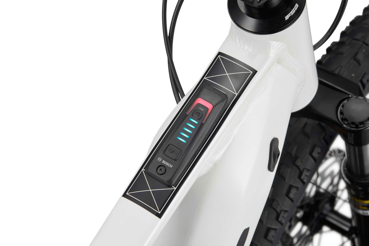 Close-up of a Haro Bikes eKids I/O 24/26 frame with Bosch Performance Line SX control panel, LED indicators, and button visible.