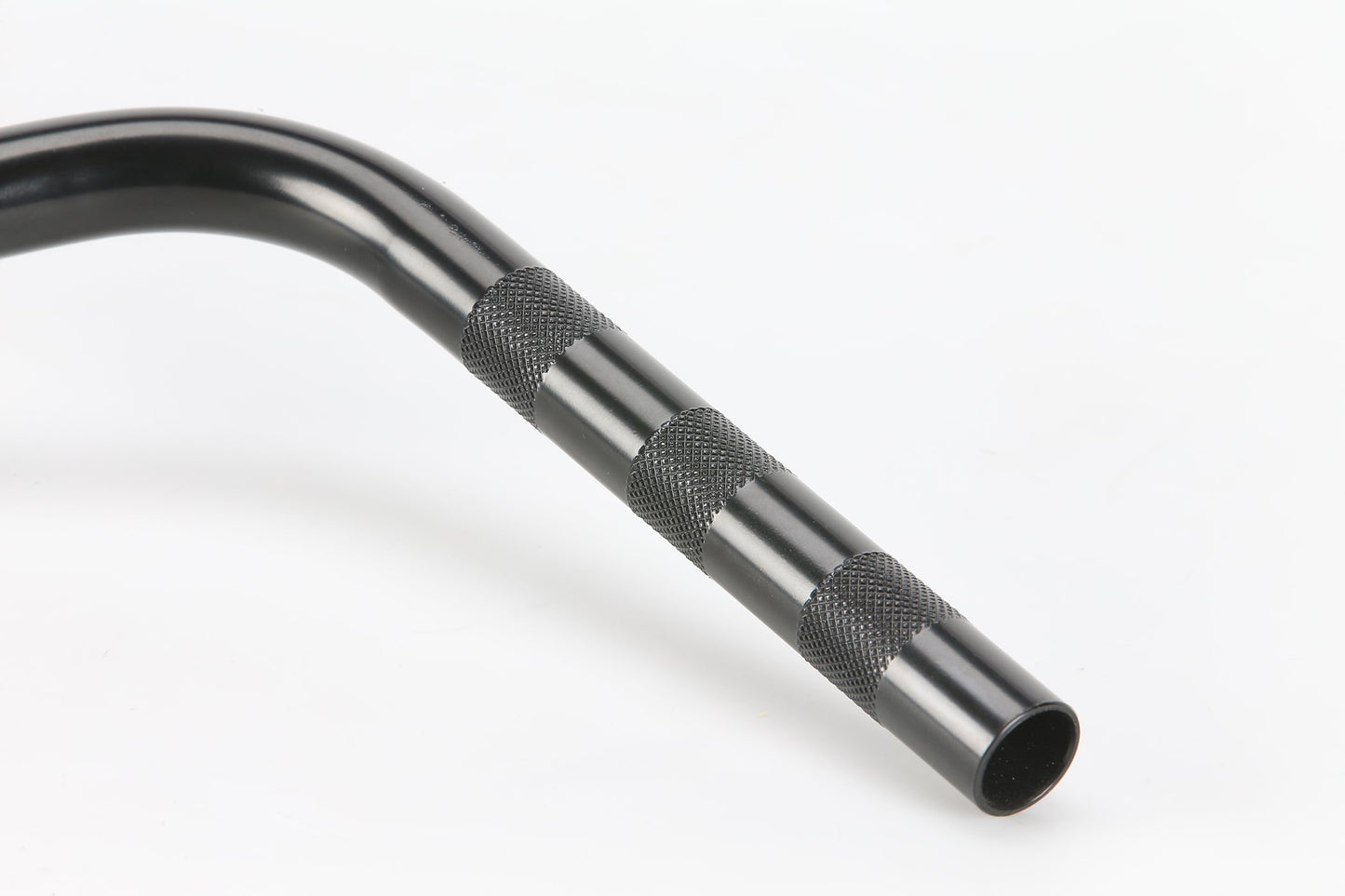 Close-up of PREMIUM Team Bars, black metal rod with textured grips and curved end, 25 Bohrungsgröße, on a white background.