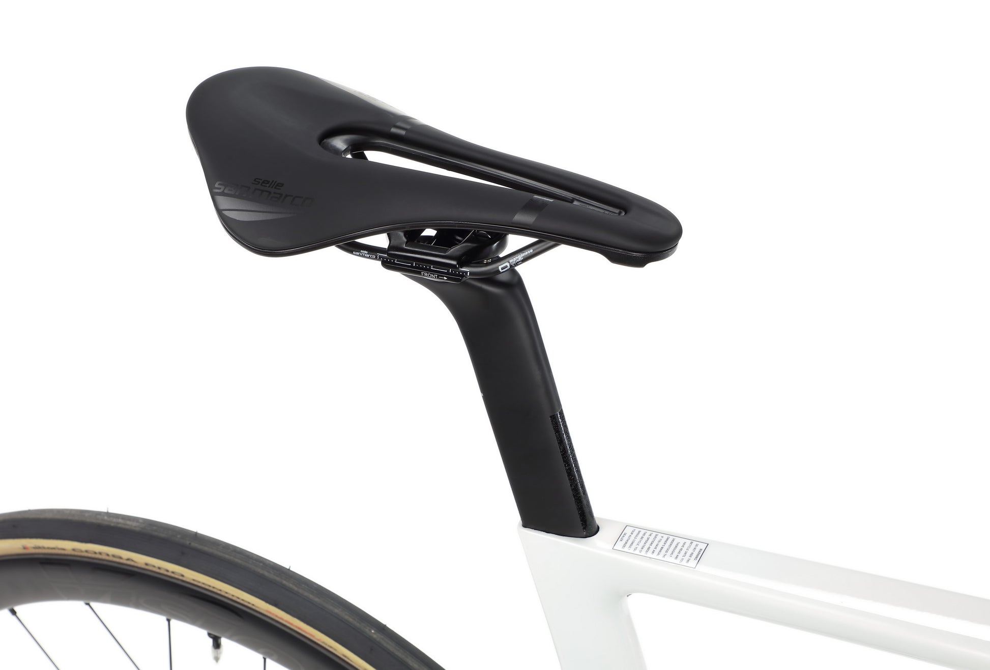 Close-up of a black saddle and seat post on the Haro Bikes Rivette Carbon EP Edition, with part of the rear wheel in view.