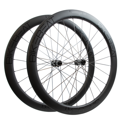 Bike Beat Überflieger Pro 50 Disc wheelset featuring black deep-section carbon aero rims with thin spokes.