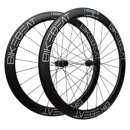 Bike Beat Überflieger Pro 50 Disc deep-rim carbon fiber bicycle wheels with black spokes and white lettering.