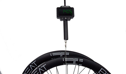 A Bike Beat Überflieger Pro 50 Disc carbon bicycle wheelset hanging from a digital scale reading 1.405 kilograms.