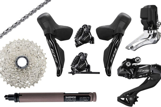 Transmission Build Kit Road Shimano 105 DIs by Haro Bikes: Shifter, derailleur, cassette, chain, battery & calipers for road bikes.
